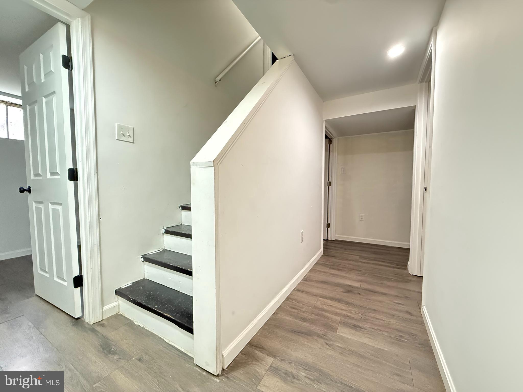 15205 Michigan Rd. Woodbridge, VA 22191 - Photo 11 of 20 a view of a hallway with wooden floor and entryway