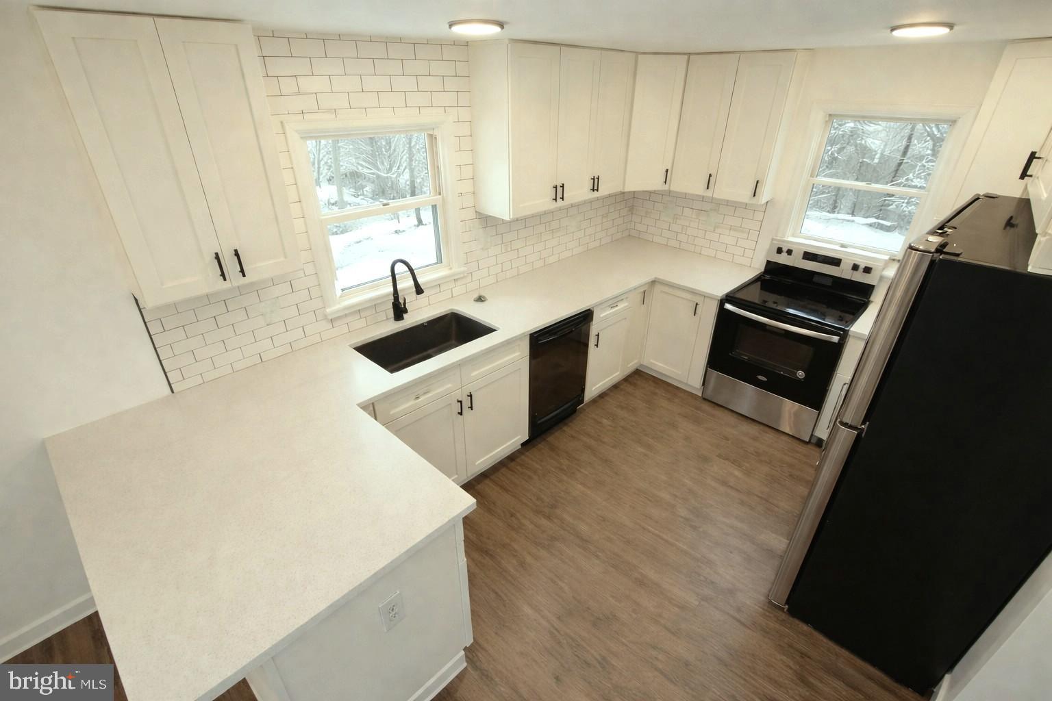 15205 Michigan Rd. Woodbridge, VA 22191 - Photo 5 of 20 a kitchen with stainless steel appliances a sink stove and cabinets