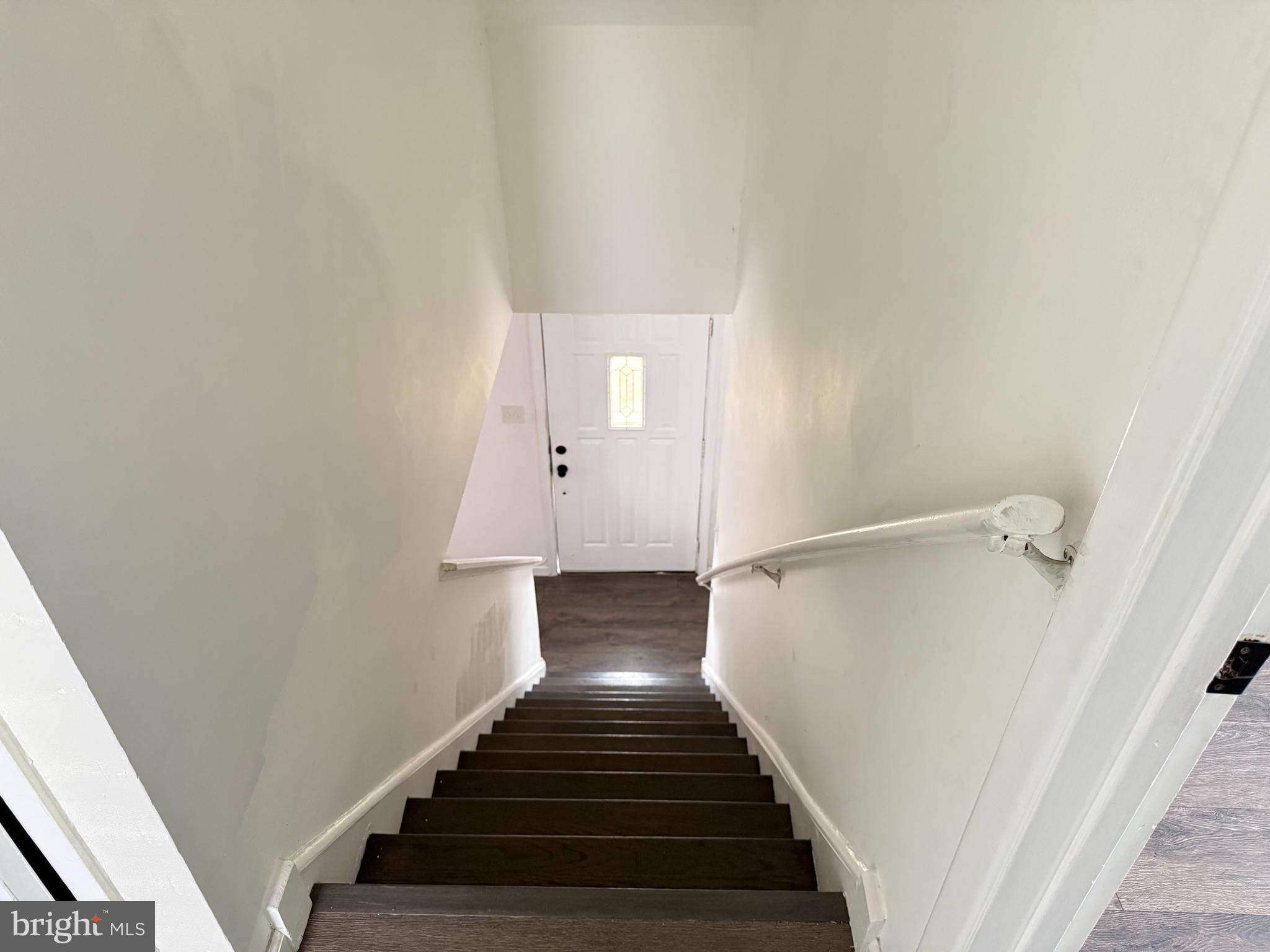 15205 Michigan Rd. Woodbridge, VA 22191 - Photo 9 of 20 a view of a hallway with wooden floor and entryway