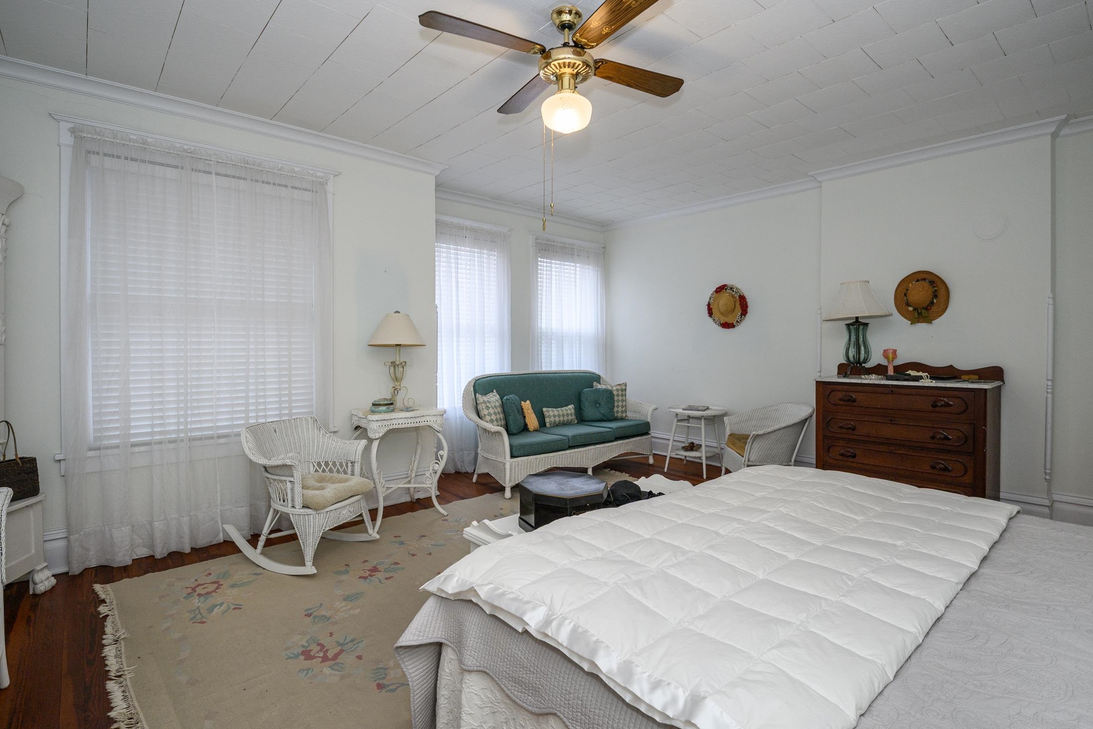 24 Saragossa Street St. Augustine, FL 32084 - Photo 45 of 99 a bedroom with a bed and a chandelier