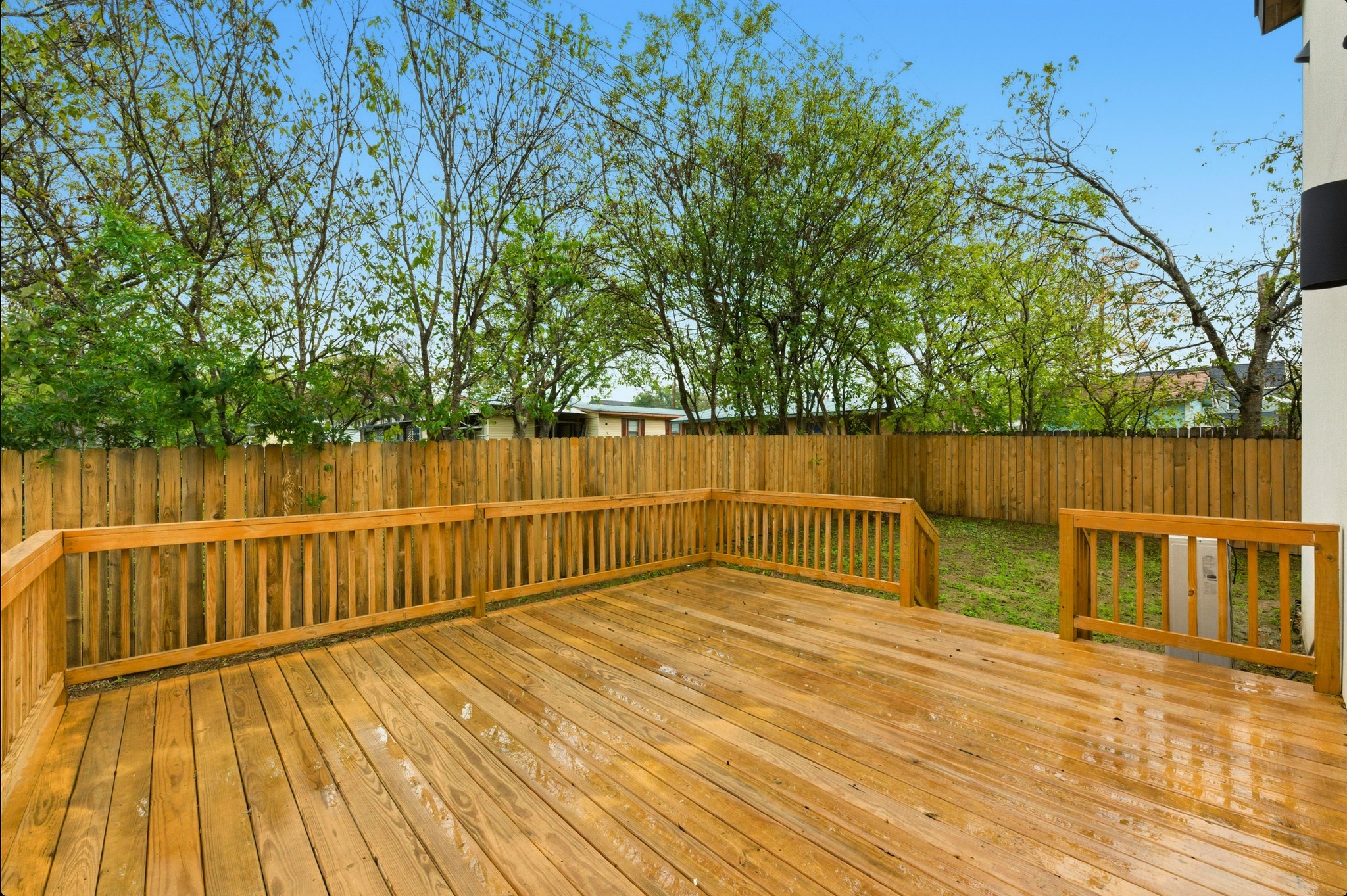 802 Philco Drive, Unit 2 Austin, TX 78745 - Photo 22 of 29 a view of a deck with wooden floor and fence