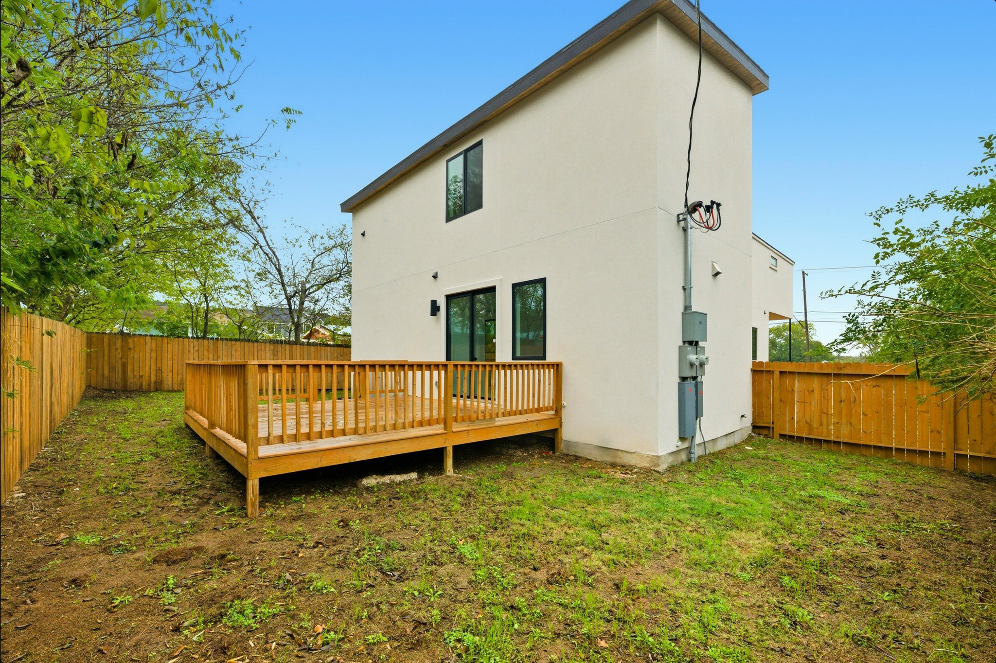 802 Philco Drive, Unit 2 Austin, TX 78745 - Photo 23 of 29 a view of a house with a yard and wooden fence