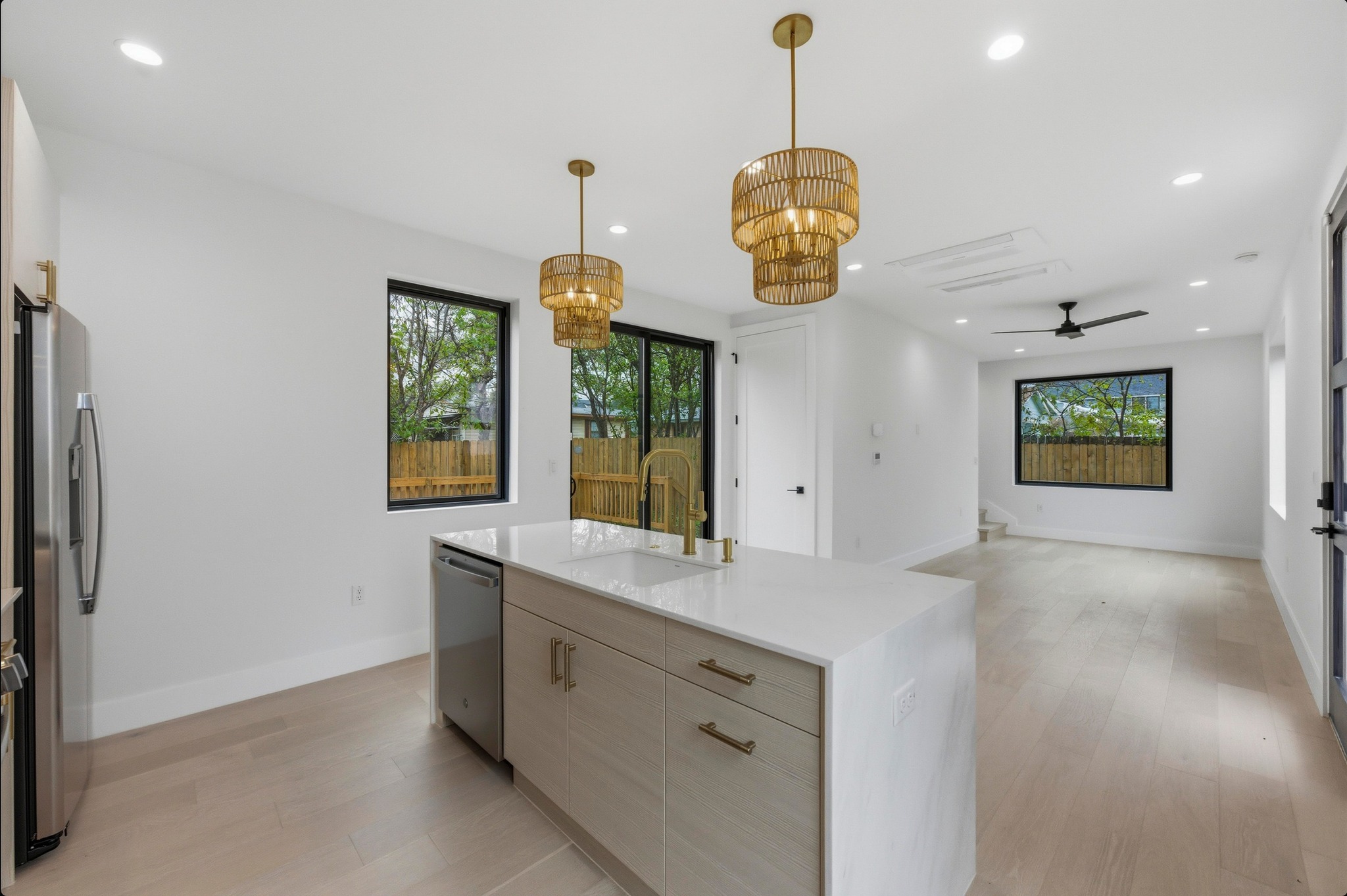 802 Philco Drive, Unit 2 Austin, TX 78745 - Photo 29 of 29 a view of a kitchen with a sink and dishwasher with wooden floor