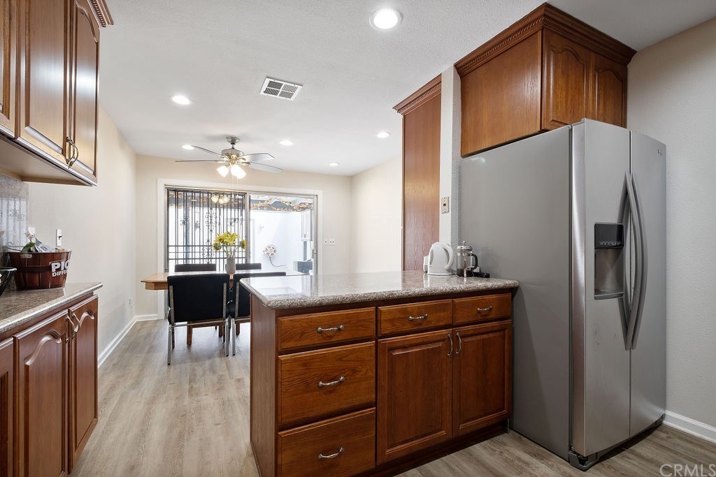 1085 Driftwood Circle Placentia, CA 92870 - Photo 6 of 18 a kitchen with a refrigerator and a counter top space