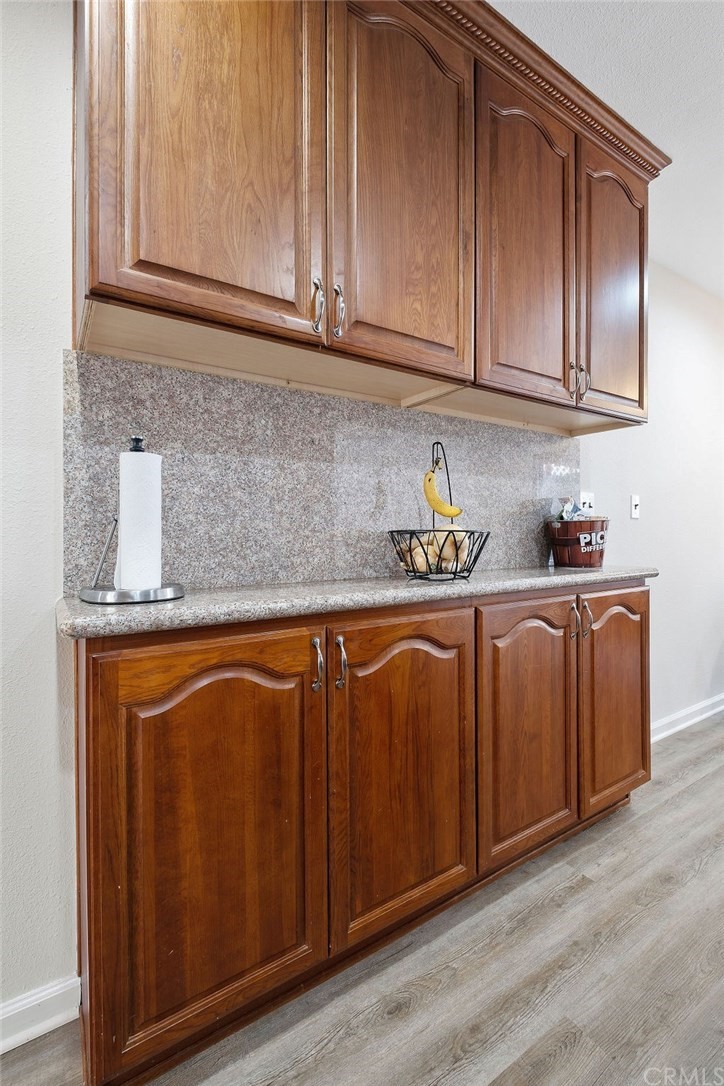 1085 Driftwood Circle Placentia, CA 92870 - Photo 7 of 18 a kitchen with stainless steel appliances granite countertop wooden cabinets a sink and dishwasher