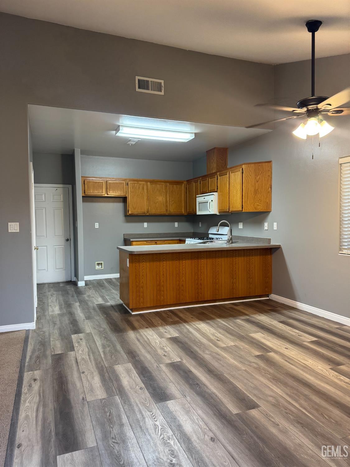 Undisclosed Address Bakersfield, CA 93307 - Photo 3 of 12 a view of a kitchen with a sink and cabinets