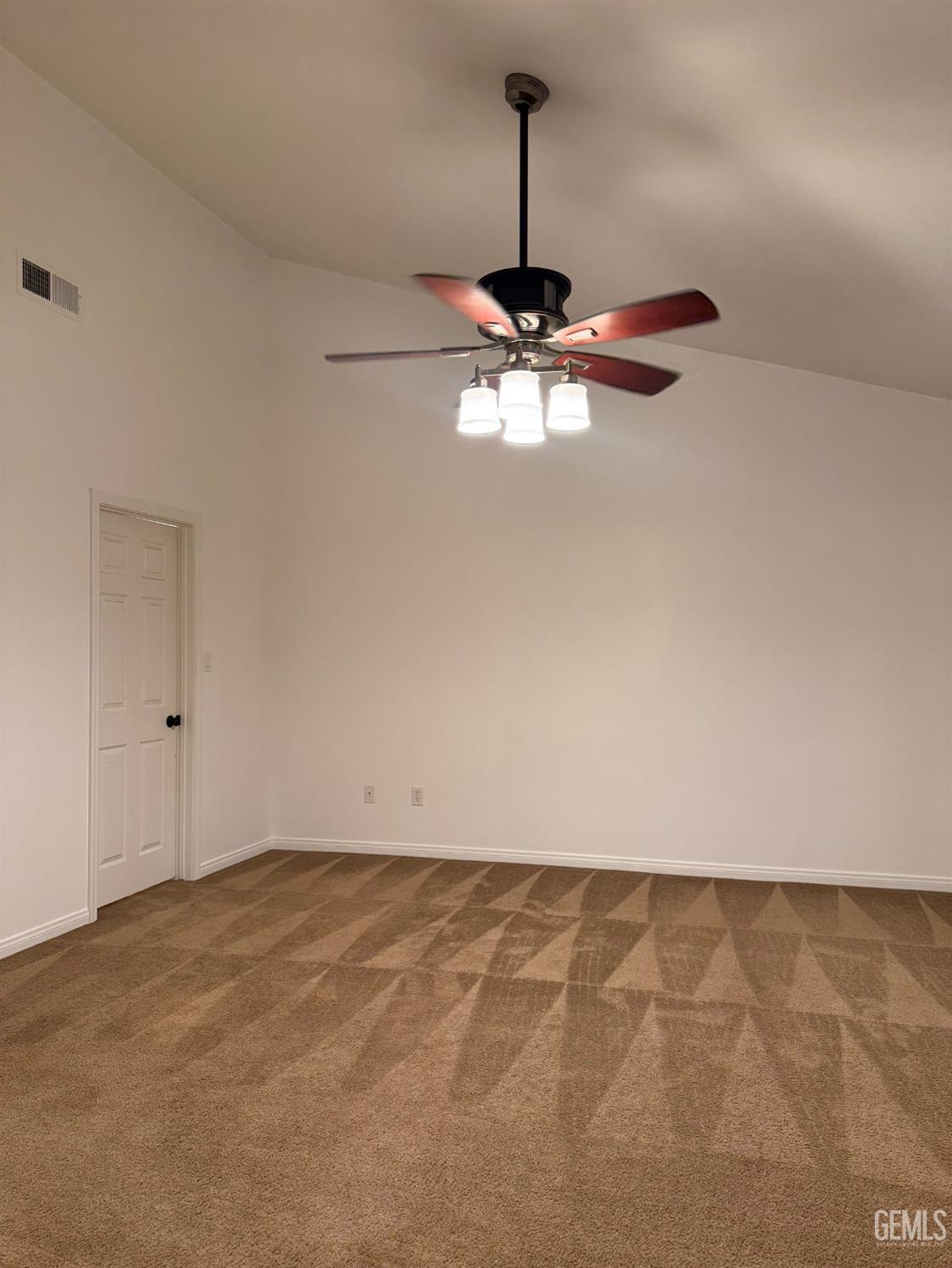 Undisclosed Address Bakersfield, CA 93307 - Photo 6 of 12 a view of room with a ceiling fan and wooden floor
