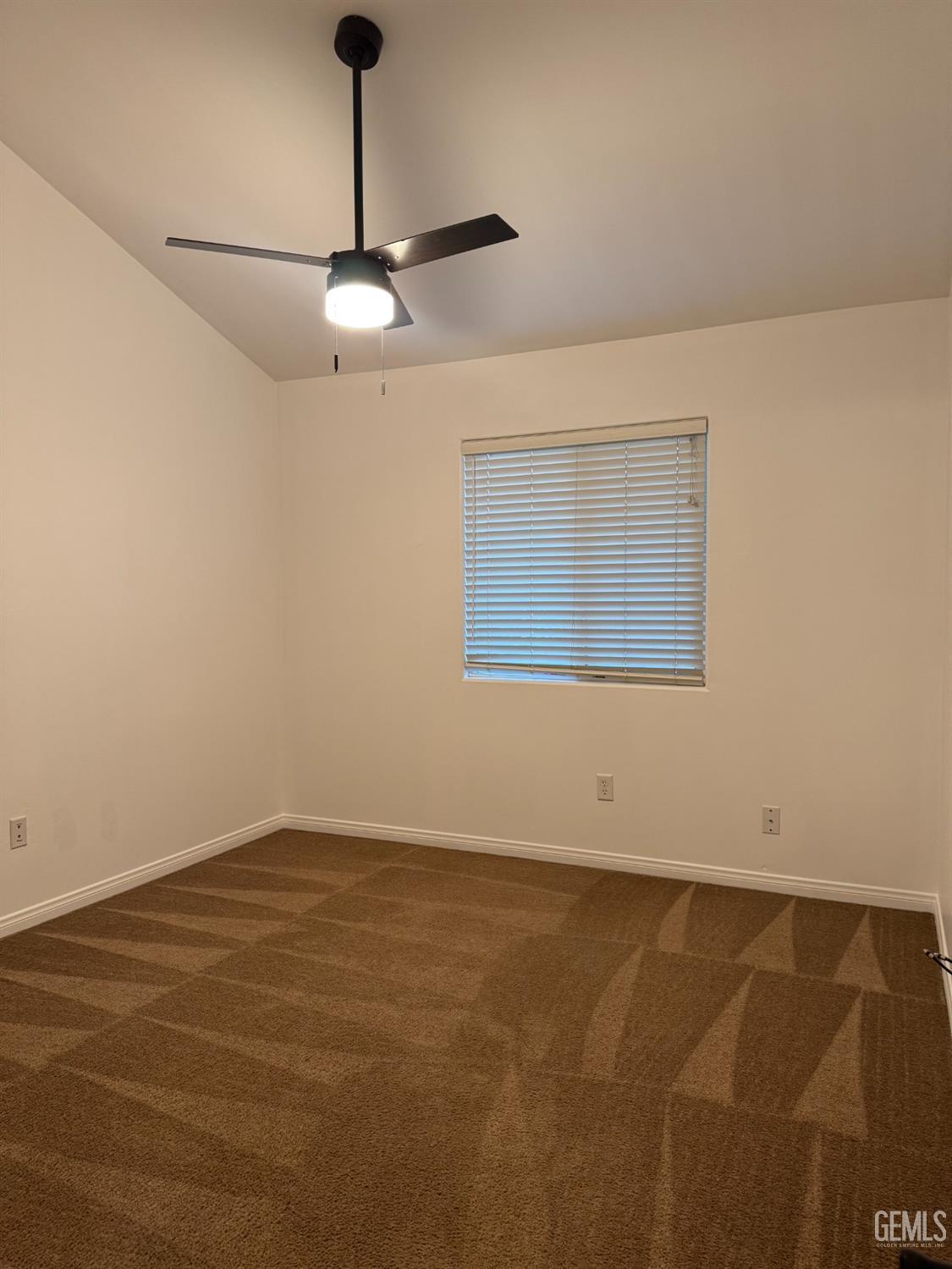 Undisclosed Address Bakersfield, CA 93307 - Photo 8 of 12 a view of an empty room with a window