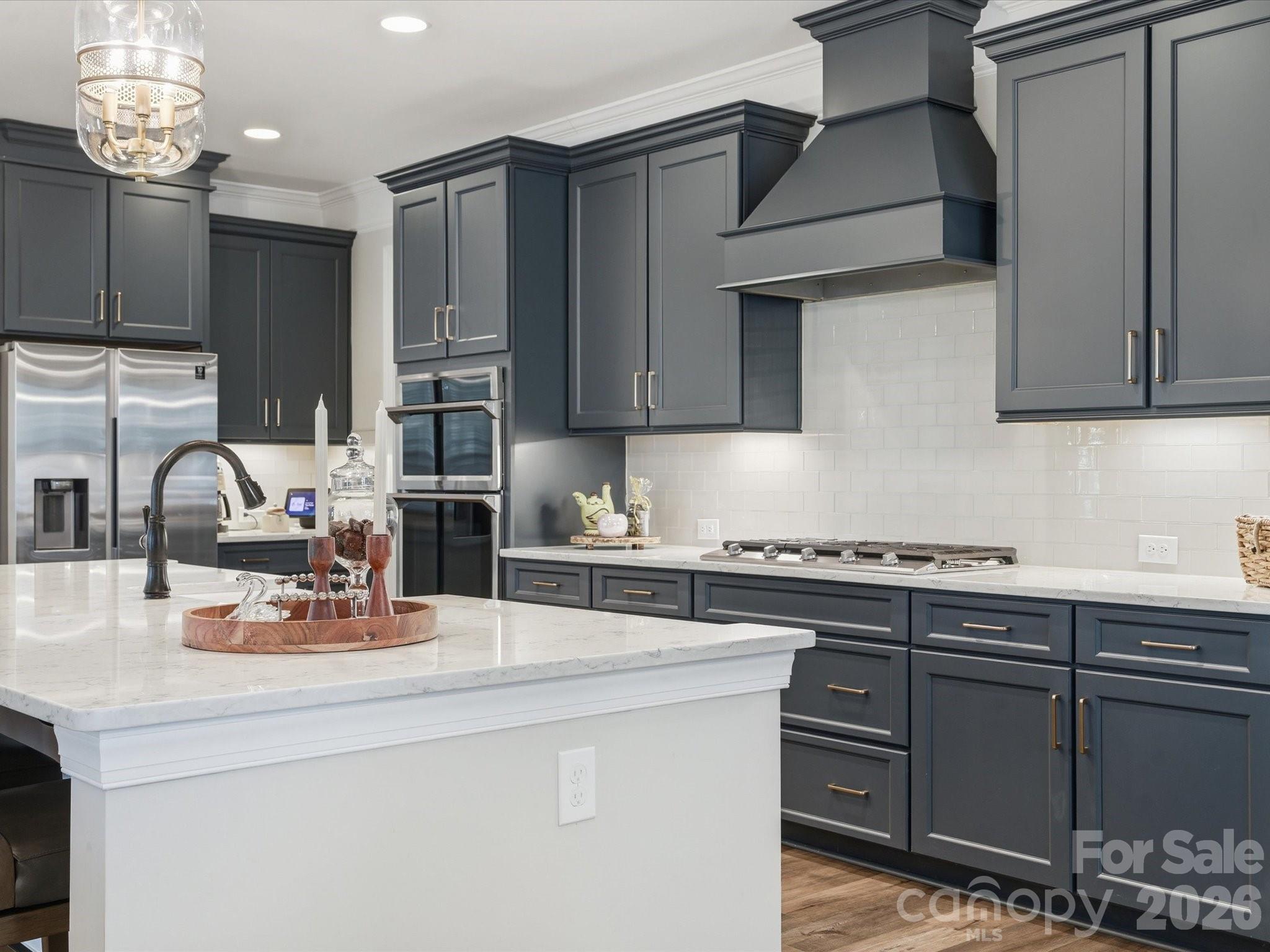 4166 Persimmon Road Lancaster, SC 29720 - Photo 15 of 41 a kitchen with kitchen island granite countertop a sink cabinets and stainless steel appliances
