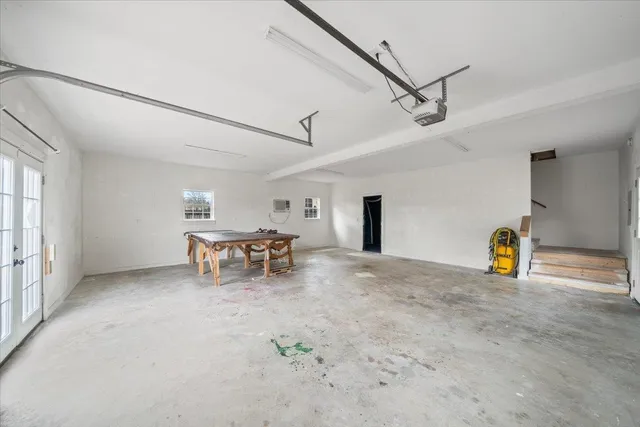 a view of a livingroom with table and chairs