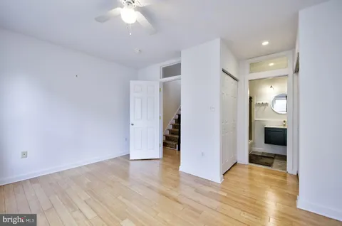 a view of a kitchen with a sink and a refrigerator