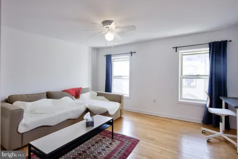 a bedroom with furniture and a window