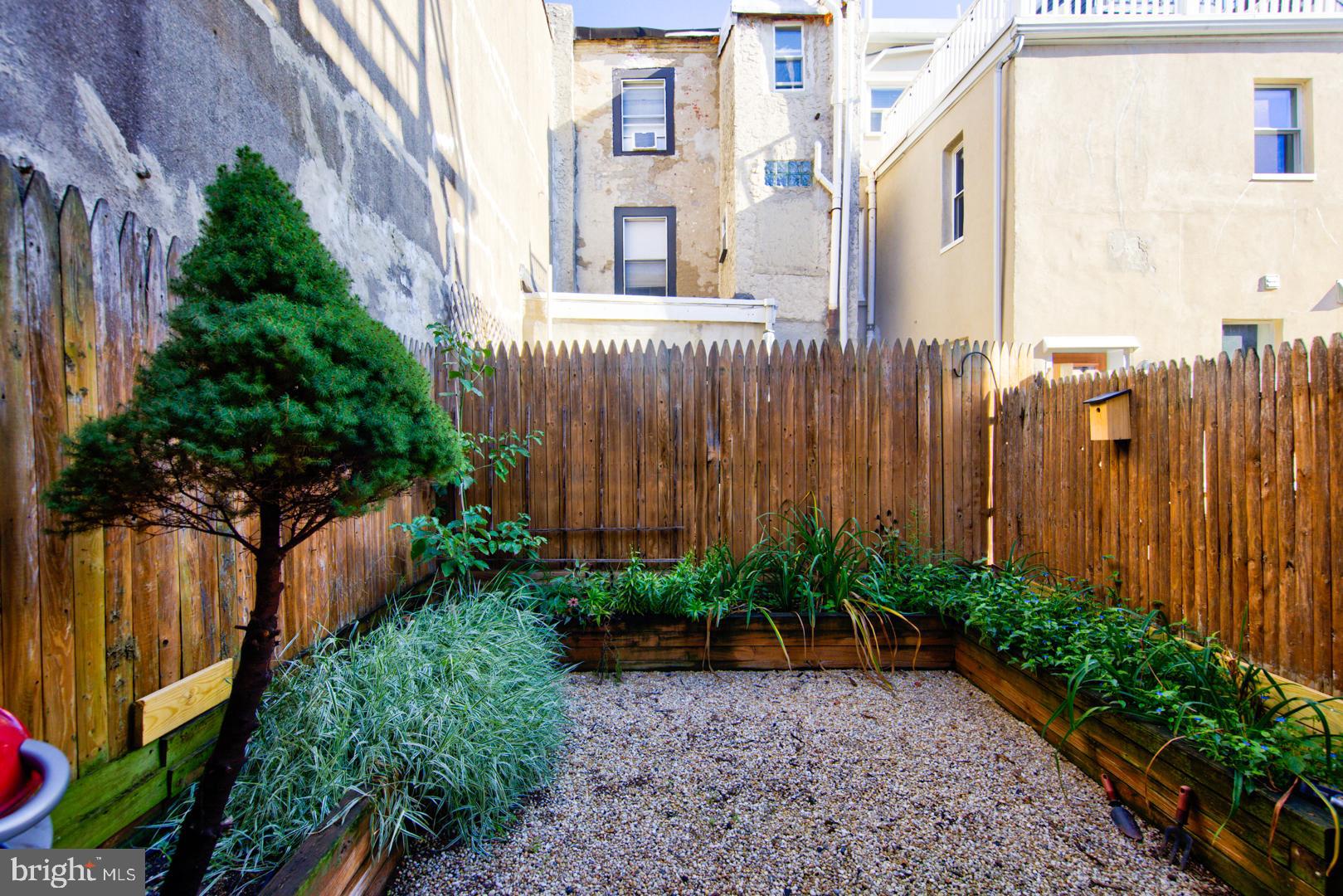 1325 Webster Street Philadelphia, PA 19147 - Photo 6 of 20 a view of a house with a garden and plants