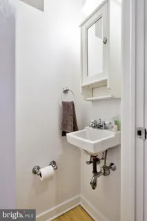 a bathroom with a sink and mirror