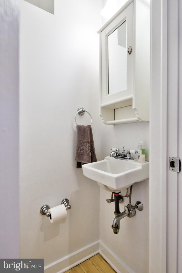 1325 Webster Street Philadelphia, PA 19147 - Photo 7 of 20 a bathroom with a sink and mirror