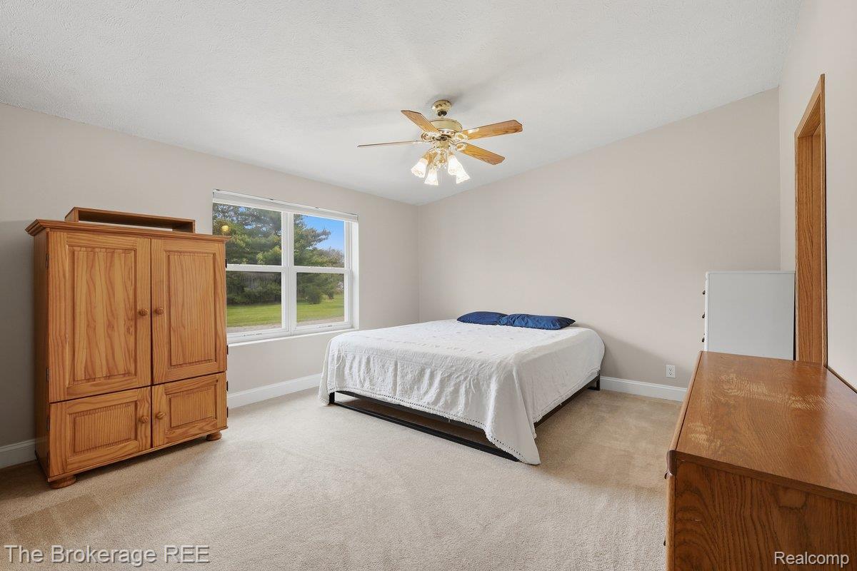 2422 South Henderson Road Davison, MI 48423 - Photo 11 of 53 Vaulted ceiling with an attached ceiling fan