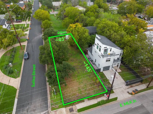 an aerial view of a house with a garden