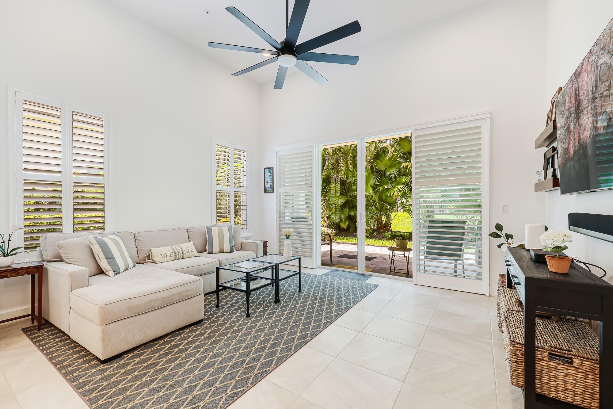 22954 Clear Echo Drive, Unit 31 Boca Raton, FL 33433 - Photo 12 of 38 a living room with furniture and a large window