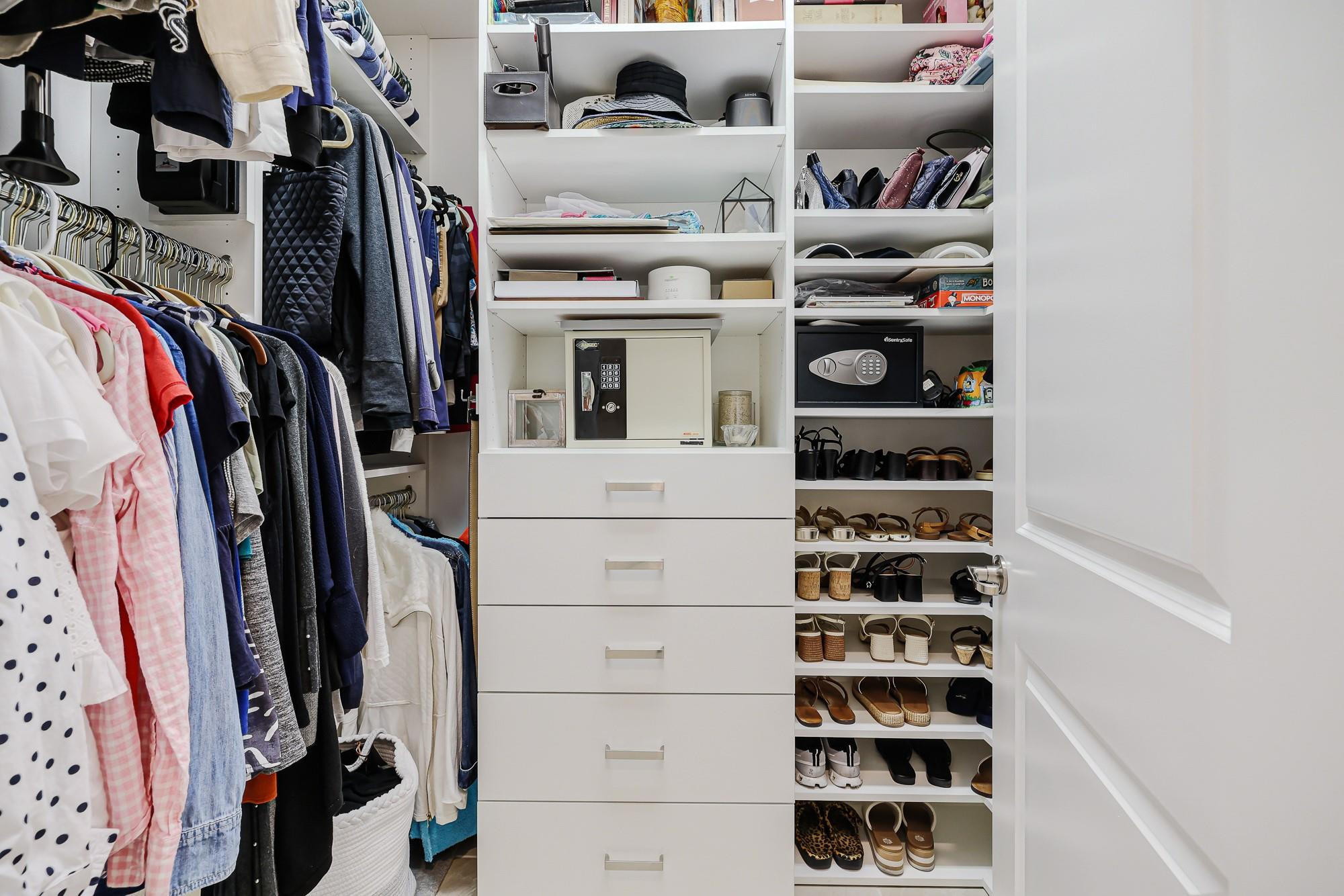 22954 Clear Echo Drive, Unit 31 Boca Raton, FL 33433 - Photo 18 of 38 a view of walk in closet with clothes and shoes