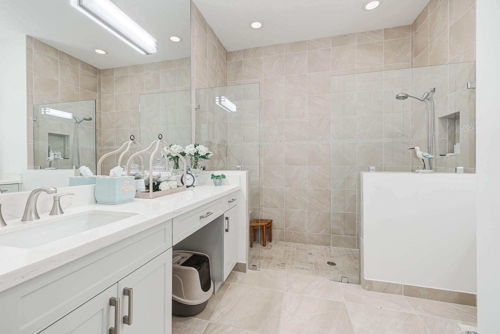 22954 Clear Echo Drive, Unit 31 Boca Raton, FL 33433 - Photo 19 of 38 a spacious bathroom with a sink double vanity and a mirror
