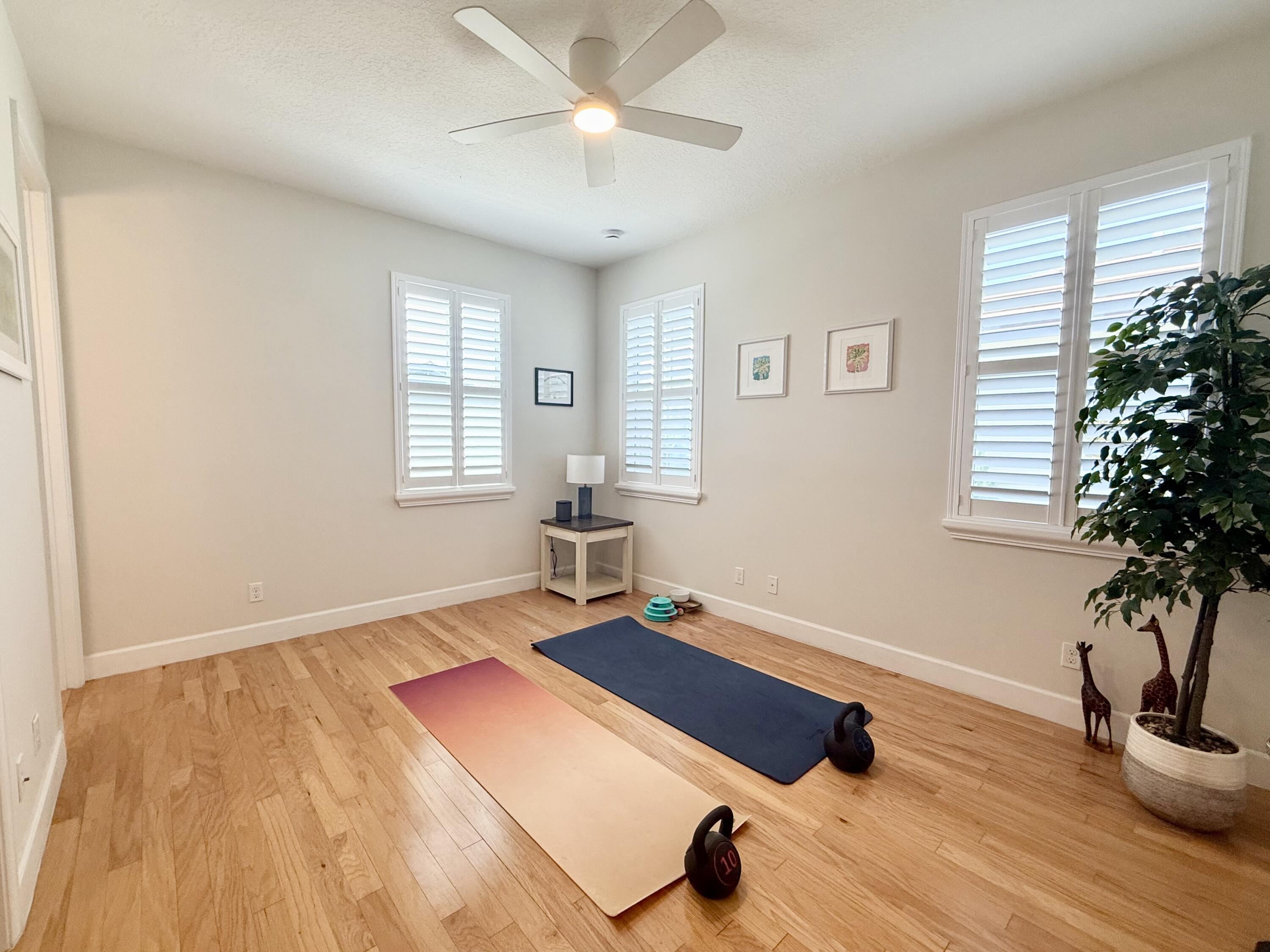 22954 Clear Echo Drive, Unit 31 Boca Raton, FL 33433 - Photo 25 of 38 a room with gym equipment and window