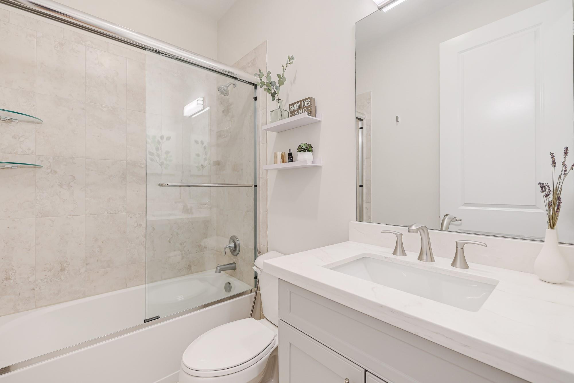 22954 Clear Echo Drive, Unit 31 Boca Raton, FL 33433 - Photo 33 of 38 a bathroom with a sink toilet and shower