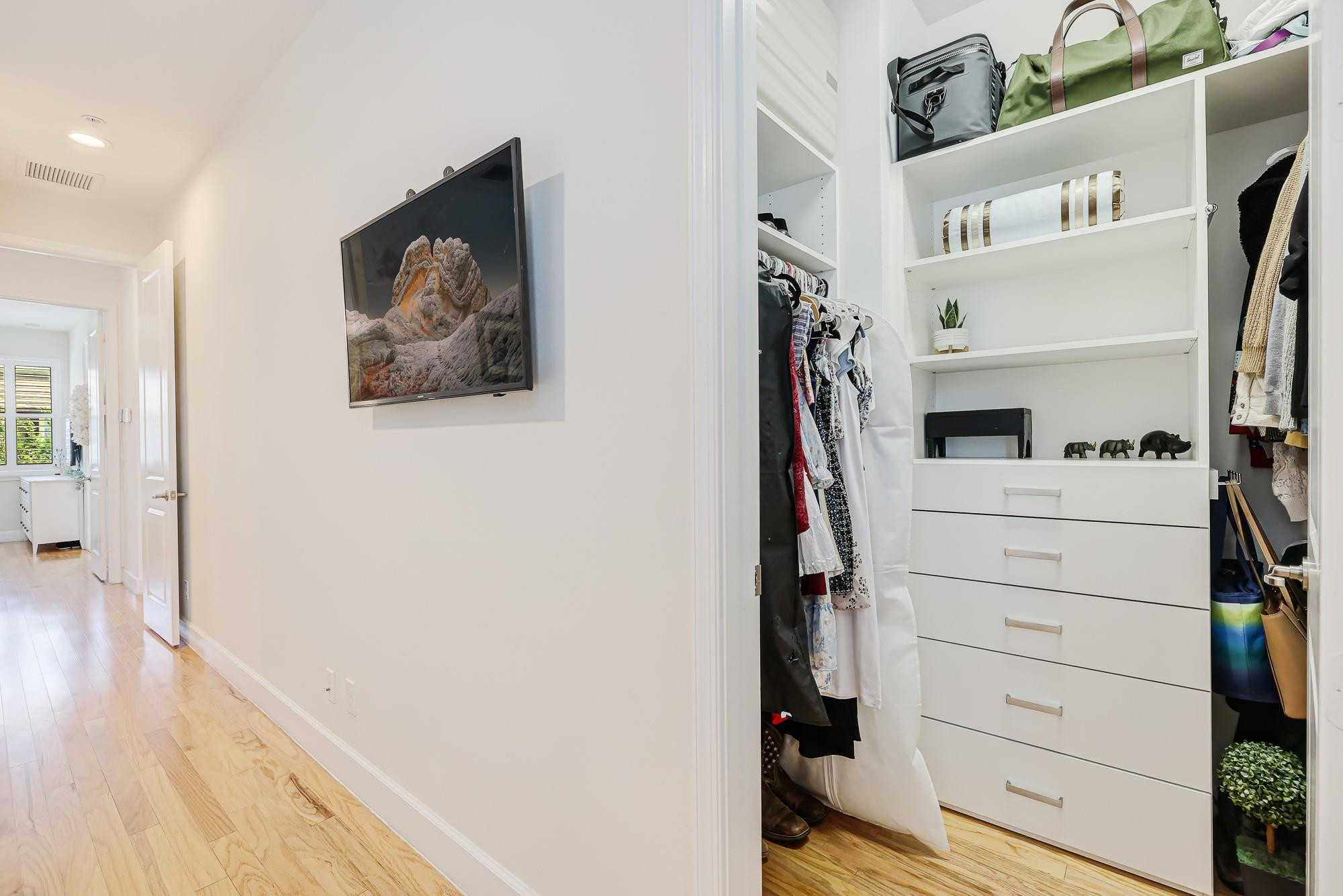 22954 Clear Echo Drive, Unit 31 Boca Raton, FL 33433 - Photo 34 of 38 a view of walk in closet with clothes and shoes