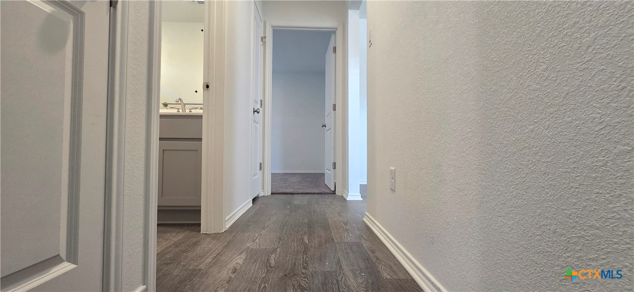 334 Monty Road Copperas Cove, TX 76522 - Photo 12 of 17 a view of a hallway with wooden floor