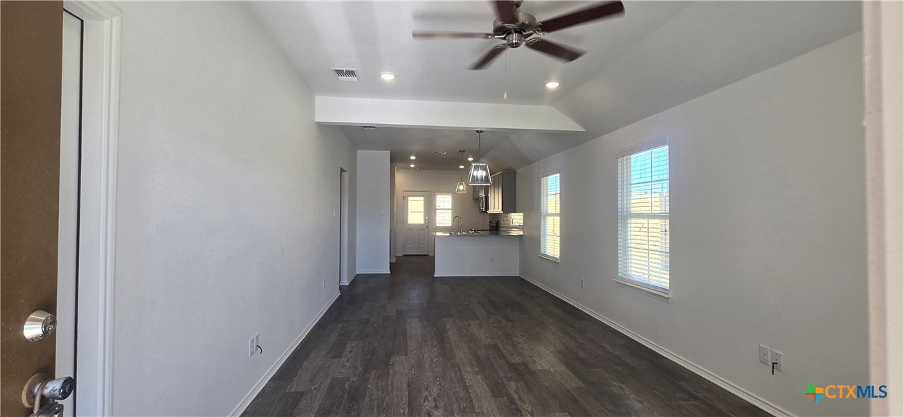 334 Monty Road Copperas Cove, TX 76522 - Photo 2 of 17 a view of a hallway with wooden floor and a window