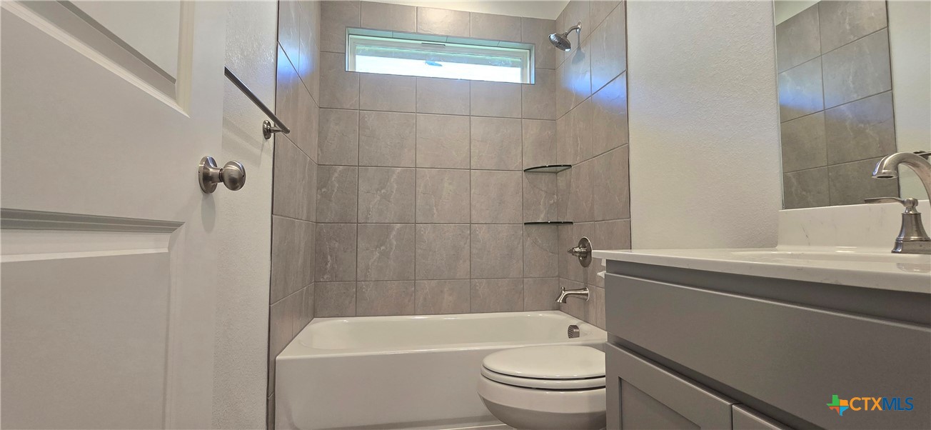 334 Monty Road Copperas Cove, TX 76522 - Photo 10 of 17 a bathroom with a sink a toilet and shower