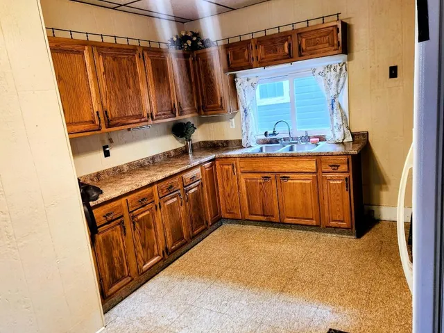 a bathroom with a sink a mirror and shower