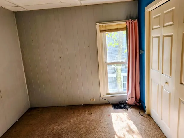 a view of a room with large windows