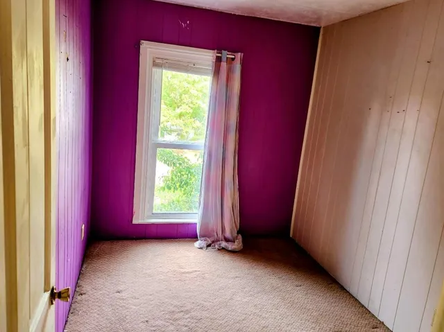 a view of an empty room and window