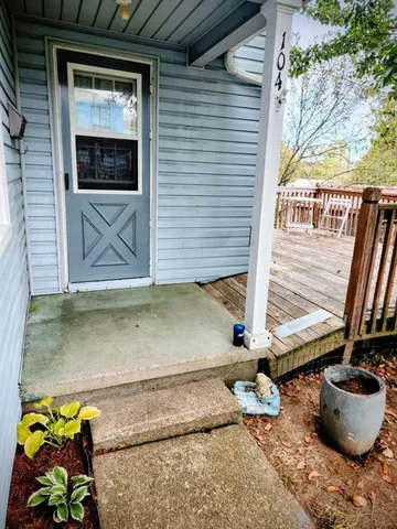 a view of house with porch