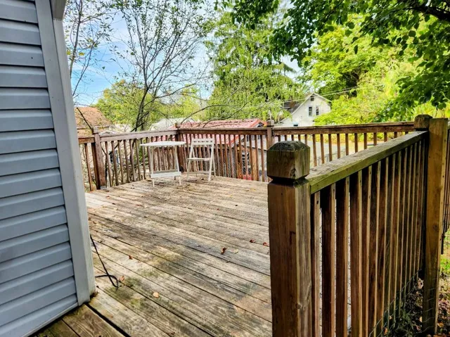a balcony with trees in front of it