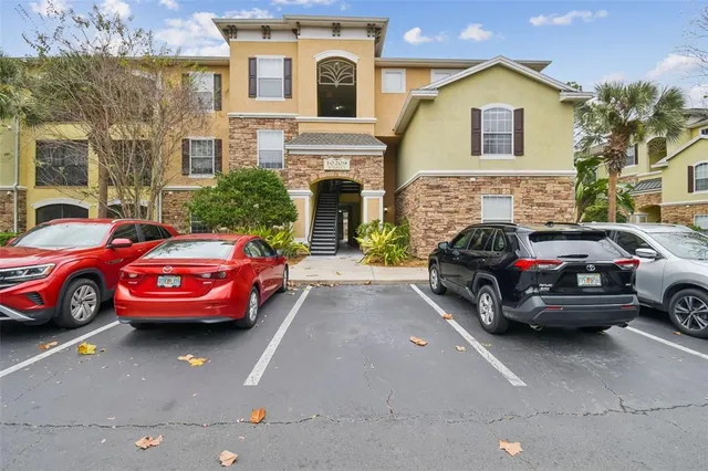 a view of cars parked in front of a building