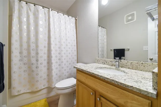 an aerial view of a house with a lake view