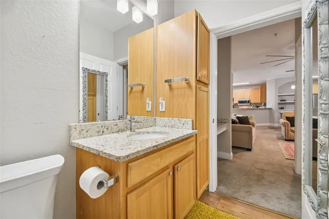 an aerial view of lake residential house with swimming pool and green space