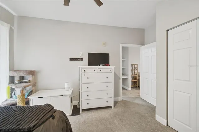 an aerial view of a house with a yard and garden