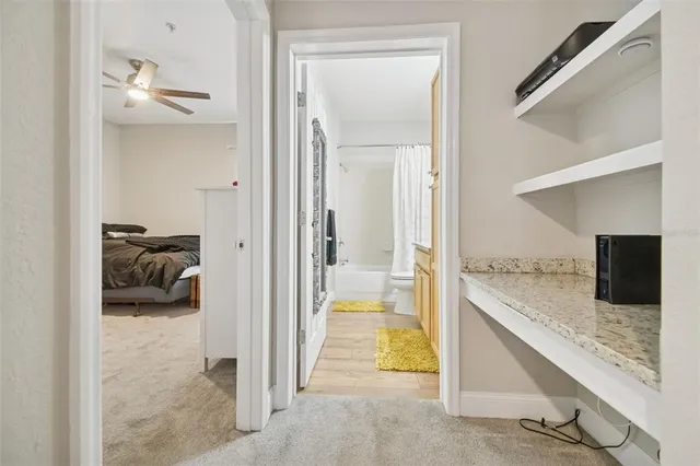 an aerial view of a house with a yard and lake view