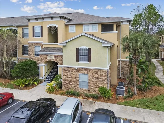 an aerial view of a house with yard swimming pool and mountain view