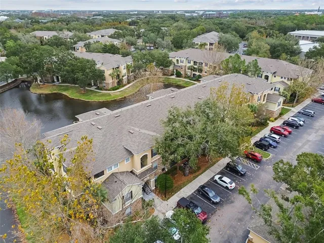 a view of a chairs and table in the backyard