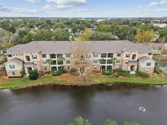 a front view of a building with trees