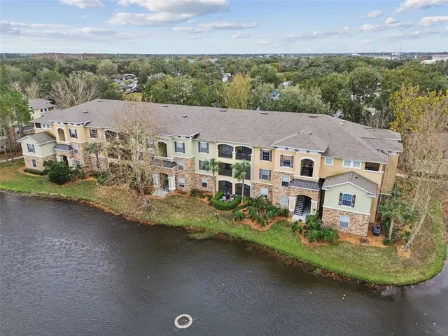 a living room with a table and a wooden floor