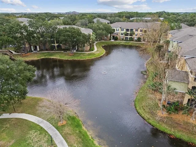 a view of yard with swimming pool and sitting area
