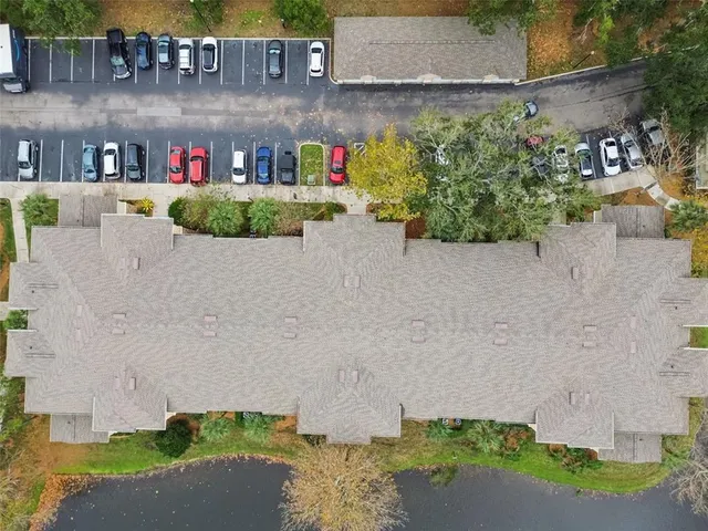 a living room with furniture and a large window with outer view