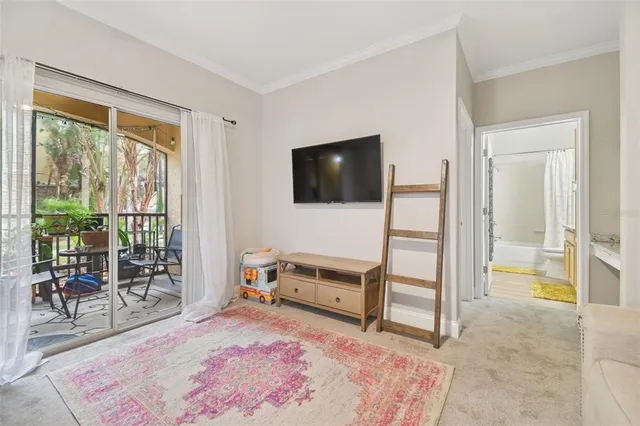 a kitchen with stainless steel appliances granite countertop a stove a sink and a refrigerator with wooden floor