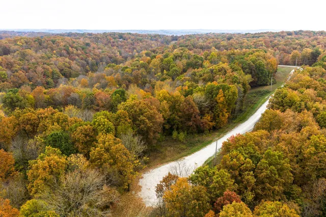 an aerial view of residential houses with city view and mountain view