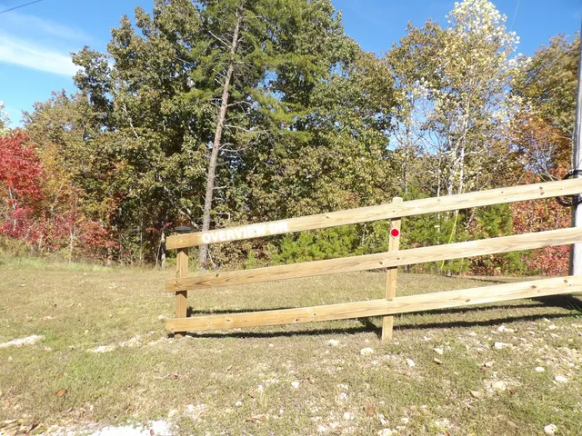 a view of a pathway to a yard