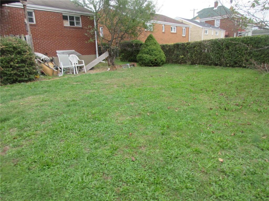 1027 1st Street McKees Rocks, PA 15136 - Photo 5 of 6 a view of a house with a yard